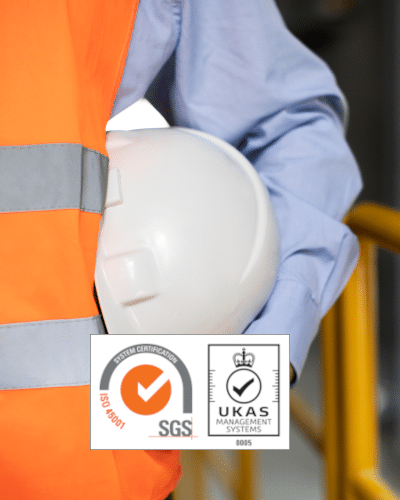 close up of Construction worker in high vis vest with hard hat under arm
