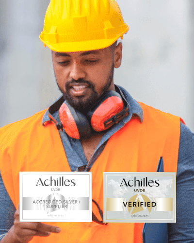 man in hard hat with ear defenders and orange high vis vest